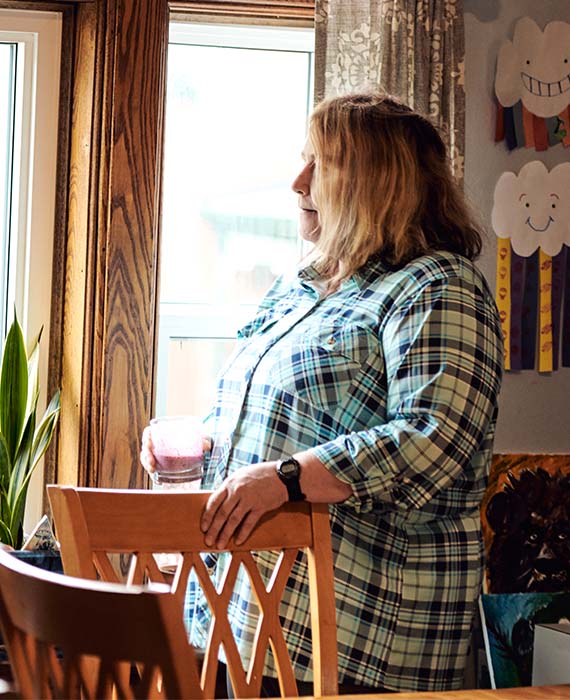 woman looking out the window